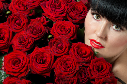 brunette woman with red roses © elena 