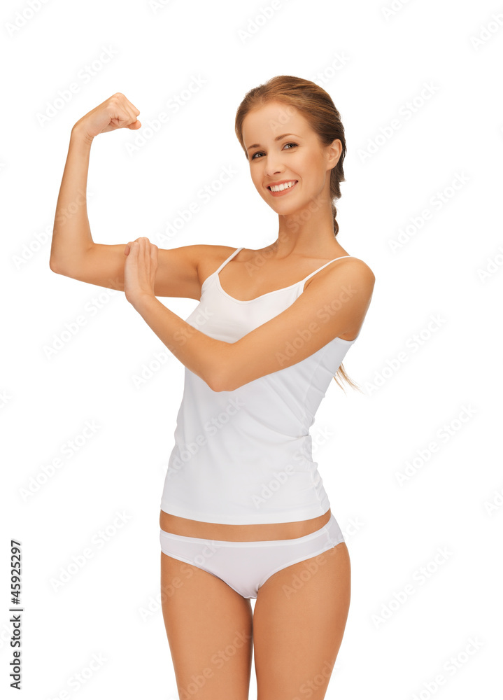 woman in cotton undrewear flexing her biceps woman in cotton undrewear flexing her biceps