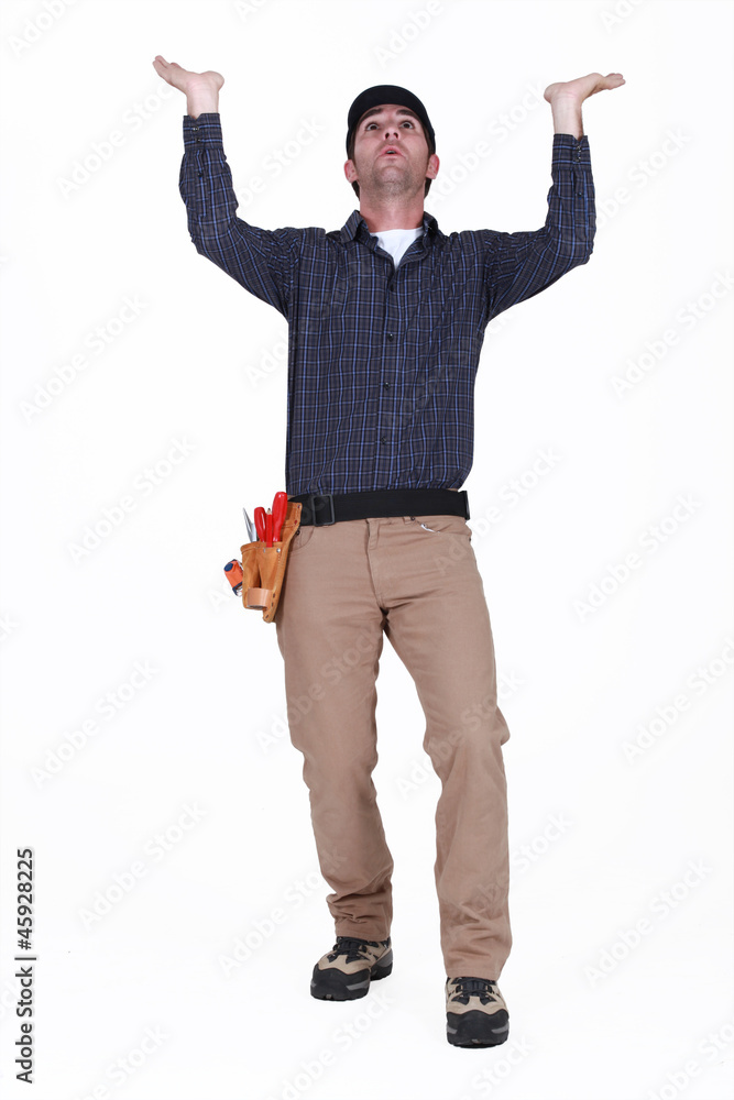 Naklejka premium Laborer gesturing on white background