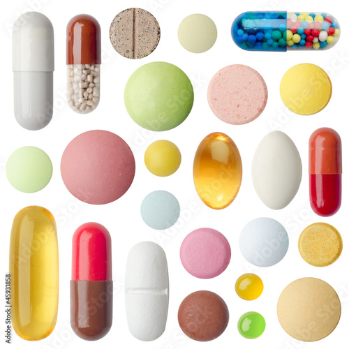 Many colorful pills isolated on white