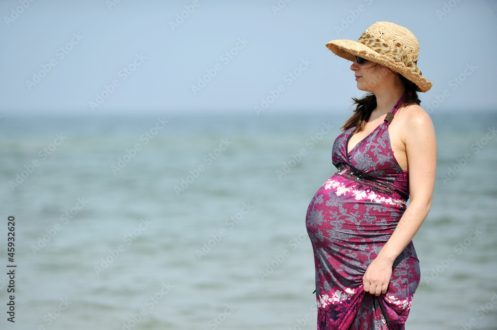 Pregnant woman at  beach