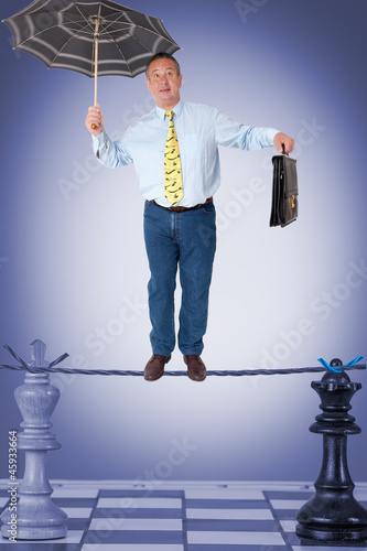 Man balancing on the rope photo