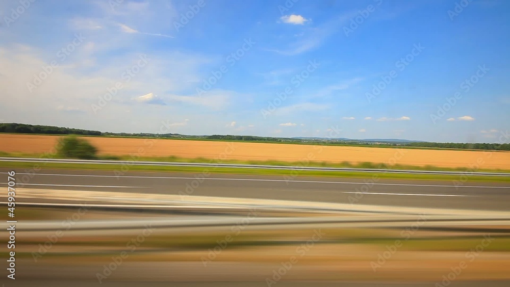 Car driving through countryside on the highway Car driving through countryside on the highway