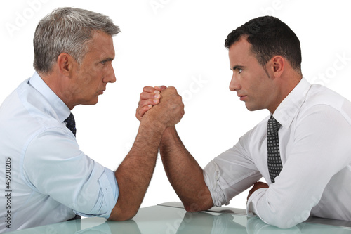 businessmen arm wrestling