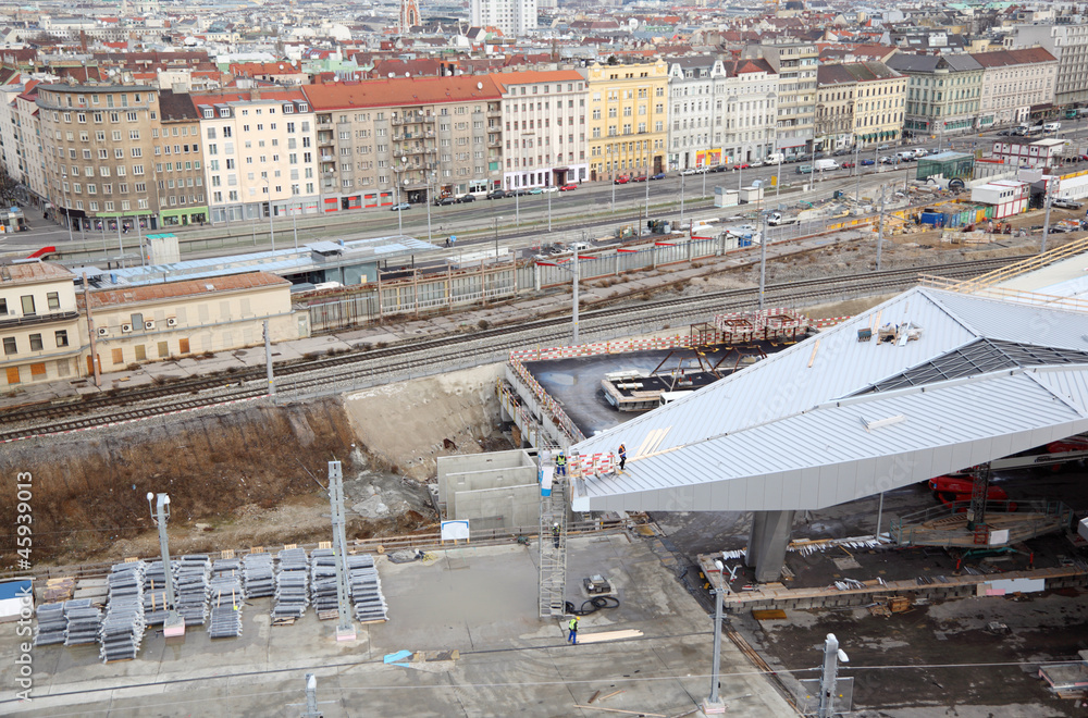 Construction of station yard near rails, buildings in day
