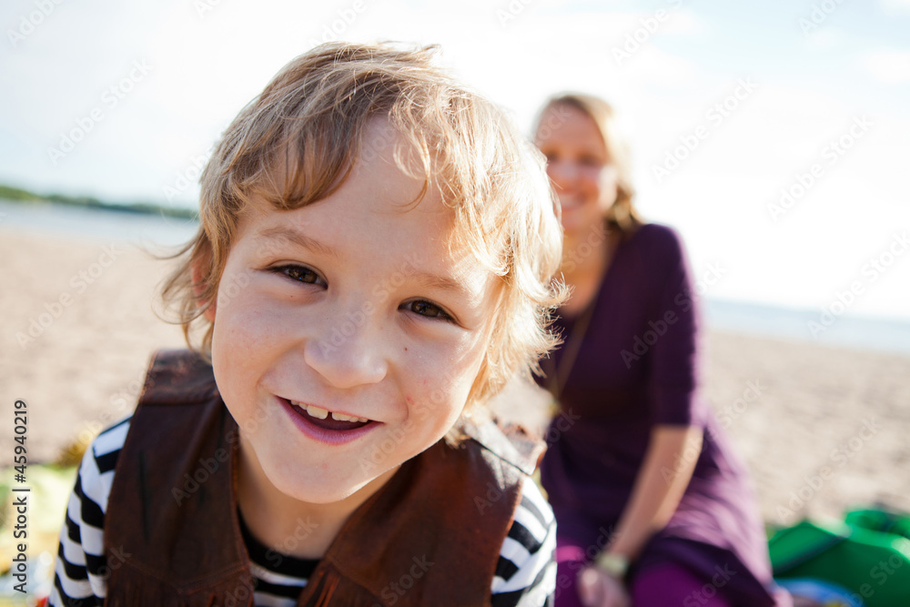 Boy and mother and the beach.