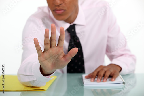 Businessman making a stop gesture