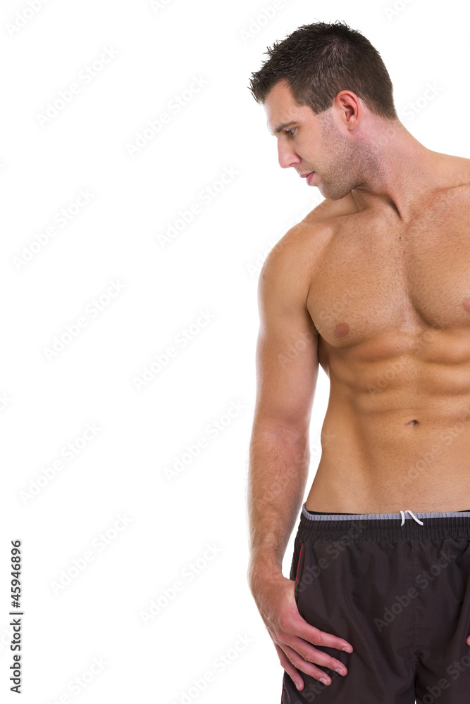 Strong athletic man looking on copy space