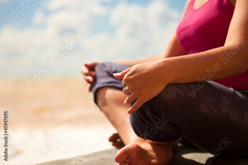 Woman sitting in relaxation yoga pose