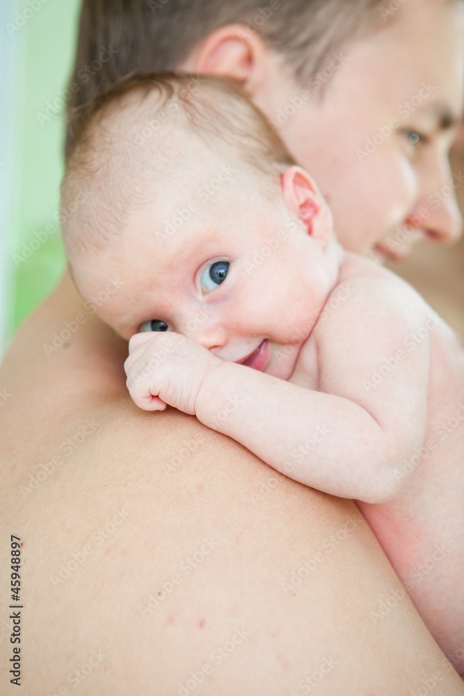 portrait of the baby on hands at the father portrait of the baby on hands at the father