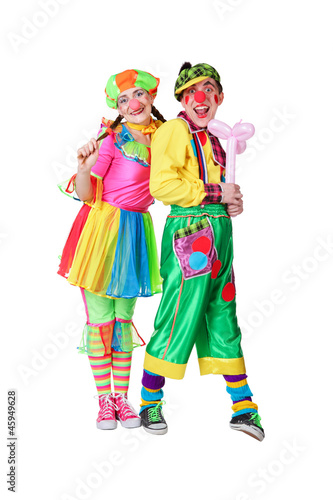 two clowns with a balloon in a hand