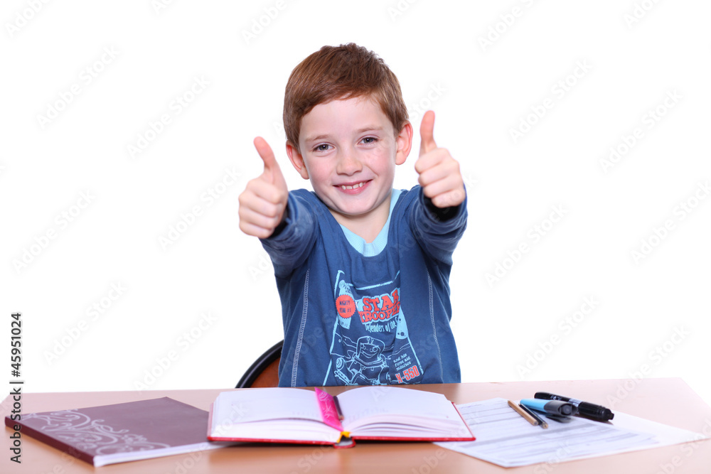 beautiful little boy sitting at the table beautiful little boy sitting at the table