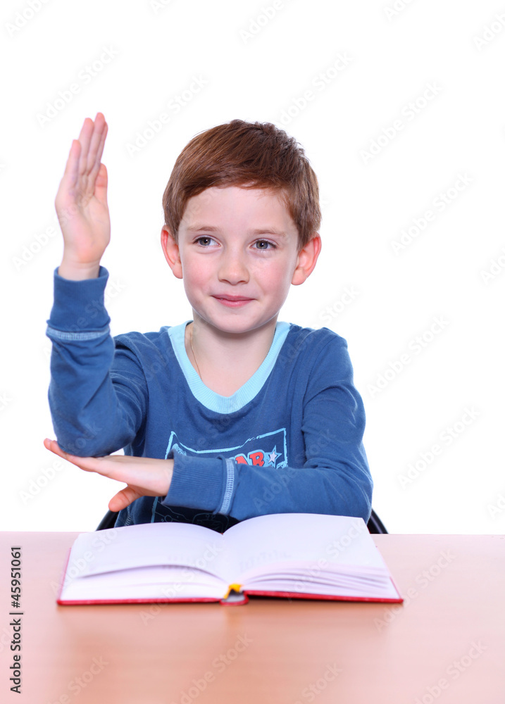 beautiful little boy sitting at the table beautiful little boy sitting at the table