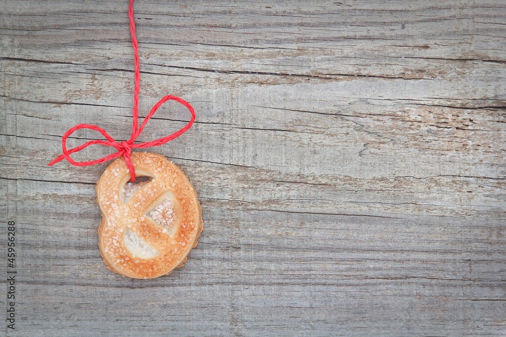 Christmas cookies biscuit, on the tape. On textured wood. Christmas cookies biscuit, on the tape. On textured wood.
