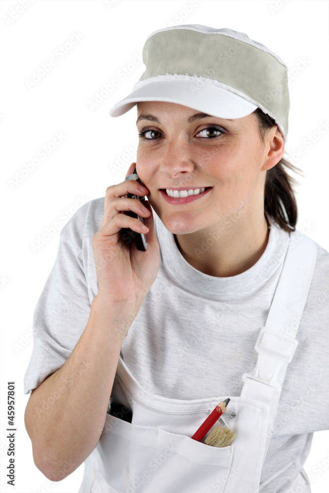 Female decorator on the telephone Female decorator on the telephone