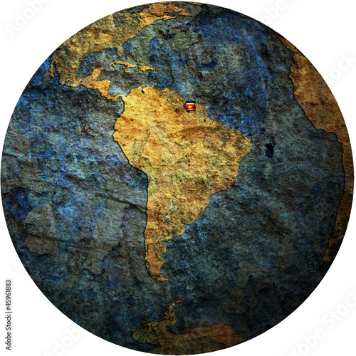 surinam flag on globe map