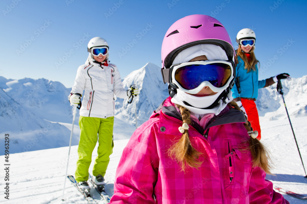 Skiing, winter sports - skiers on mountainside