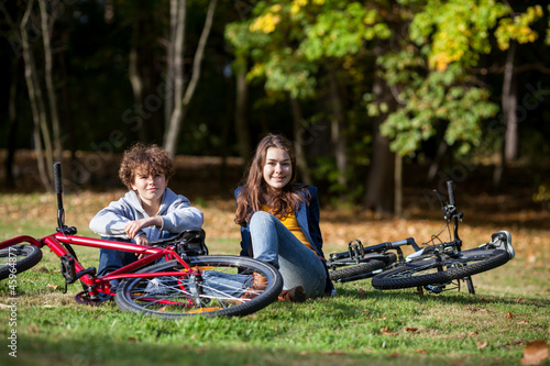 Teens resting after biking