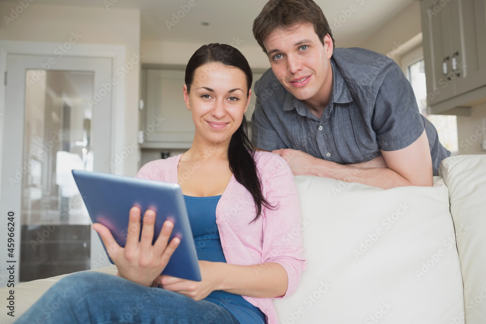 Young couple using a tablet computer Young couple using a tablet computer