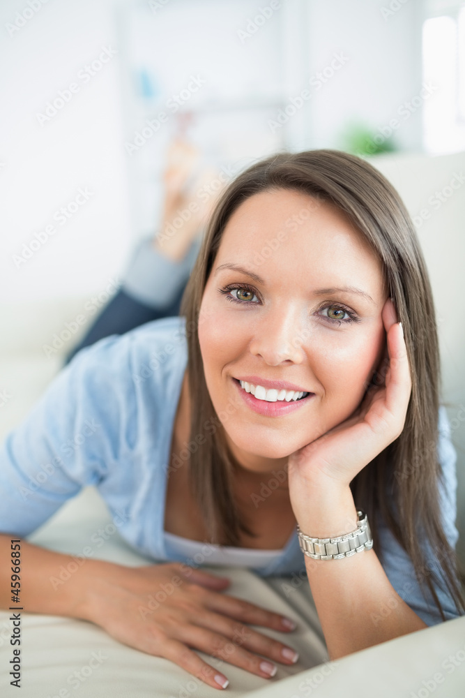 Woman looking happy on sofa Woman looking happy on sofa