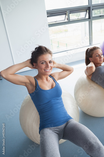 Women training on exercise ball