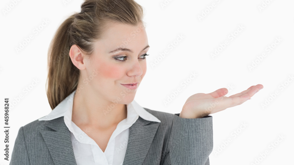 Businesswoman holding out her hand and smiling Businesswoman holding out her hand and smiling