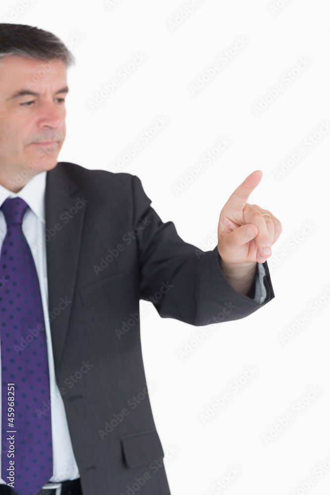 Businessman pointing on something Businessman pointing on something