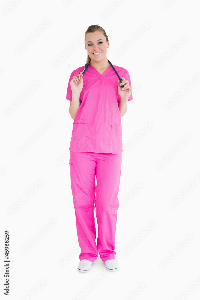 Smiling woman in pink scrubs Smiling woman in pink scrubs