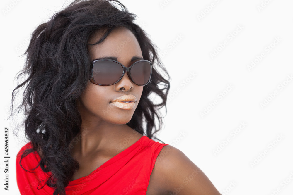Woman wearing sunglasses and a red dress Woman wearing sunglasses and a red dress