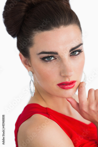 Woman with red dress looking at camera