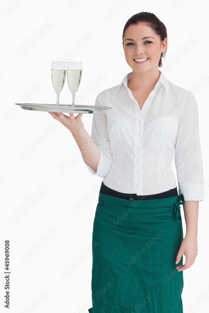 Woman in suit holding a tray with glasses Woman in suit holding a tray with glasses