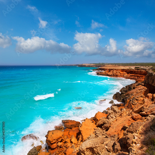 Cala Saona coast with turquoise rough Mediterranean