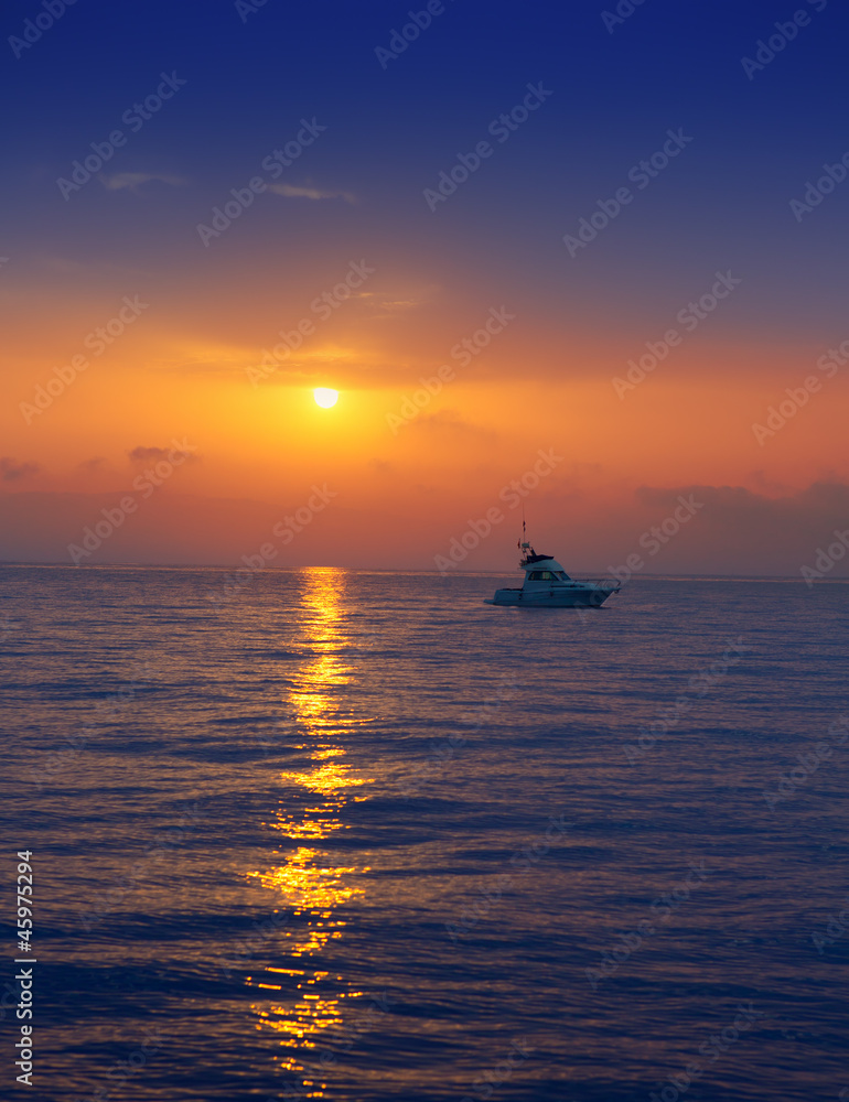 fisherboat in horizon on sunset sunrise at sea