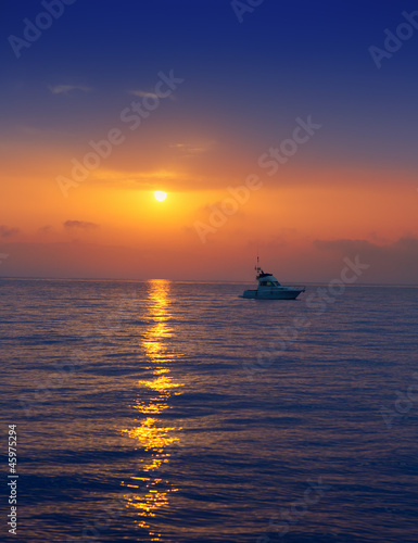 fisherboat in horizon on sunset sunrise at sea © lunamarina