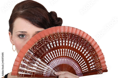 Woman holding fan