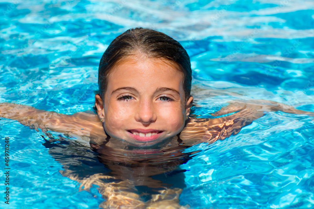 blue eyes kid girl at the pool face in water surface