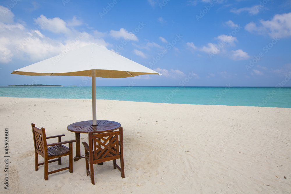 table with chairs at the beach
