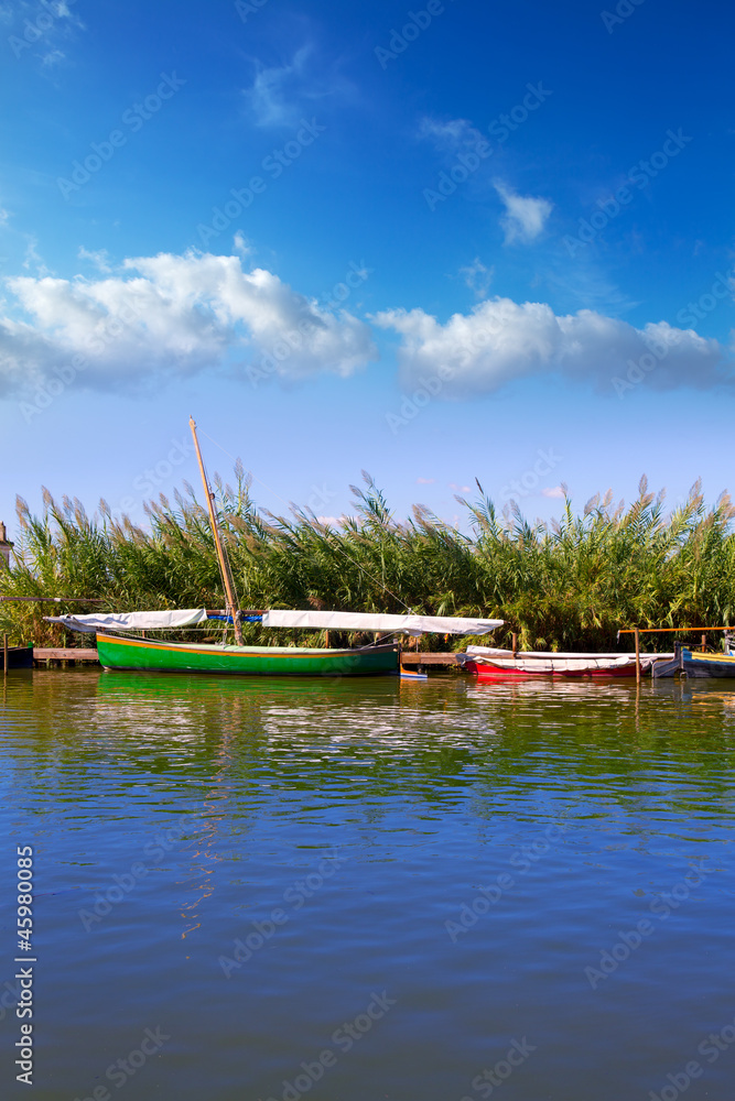 Naklejka premium Albufera channel boats in el Palmar of Valencia