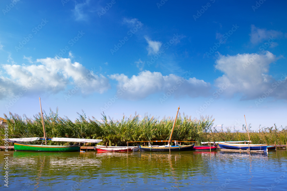Fototapeta premium Albufera channel boats in el Palmar of Valencia