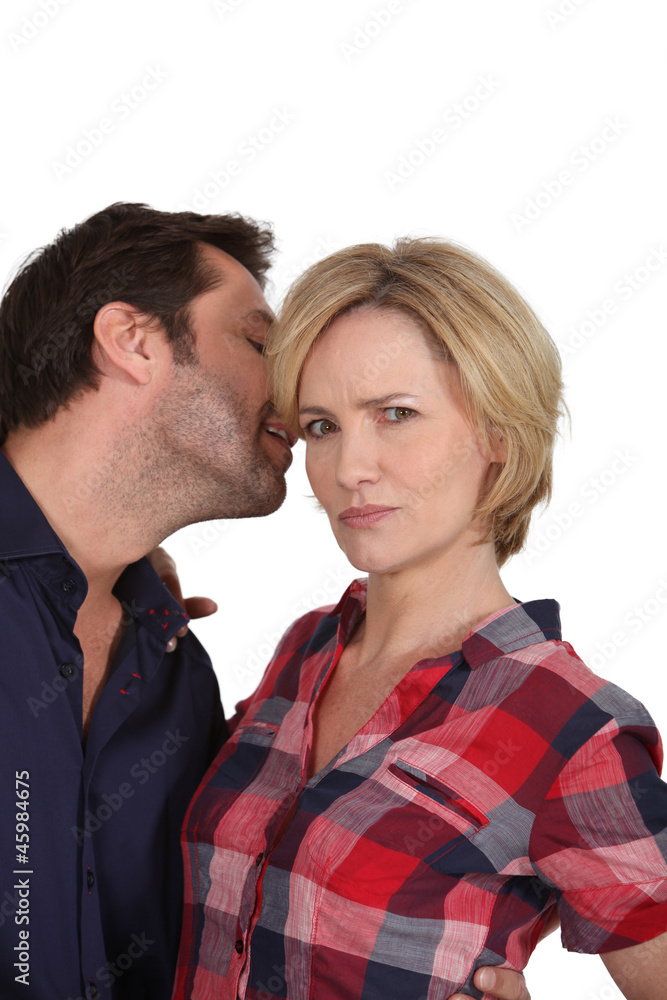 Man whispering a secret to his partner Man whispering a secret to his partner
