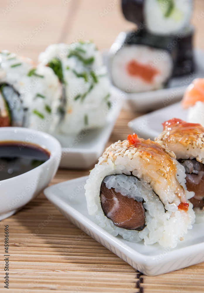 Sushi rolls with sticks and Soy Sauce Sushi rolls with sticks and Soy Sauce