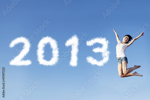 Woman jump welcoming new year 2013 © Creativa Images