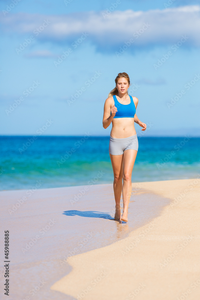 Beautiful Athletic Woman Running on the Beach