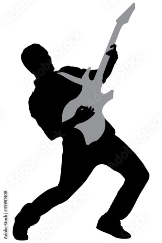 A silhouette of a rock star playing guitar