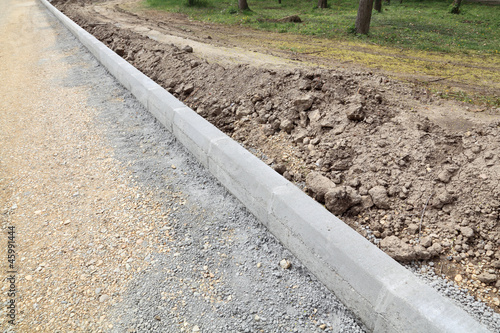 Tableau sur toile Roadworks construction site roadside stones, gravel