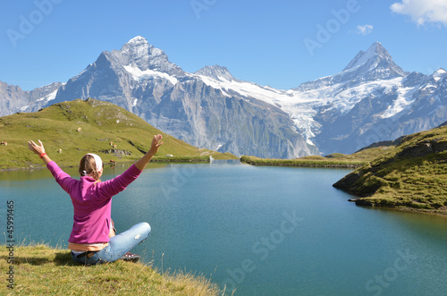 Traveler against Alpine scenery. Jungfrau region, Switzerland