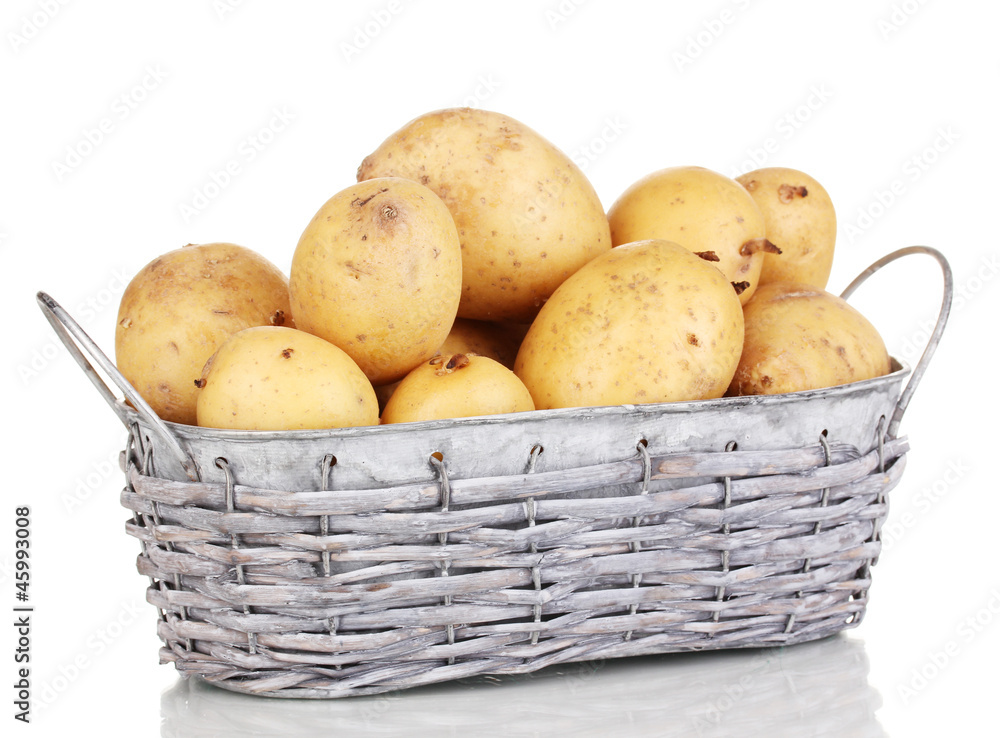 Ripe potatoes on basket isolated on white Ripe potatoes on basket isolated on white