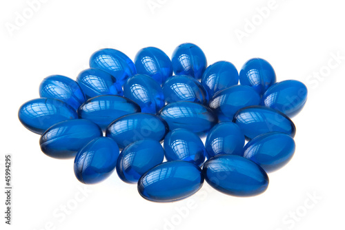 Blue pills background isolated on white