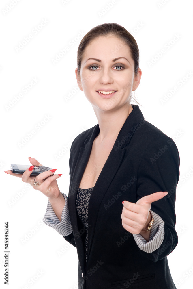 Business woman with a cell phone shows thumb Business woman with a cell phone shows thumb
