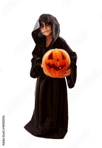 Boy in halloween zombie fancy-dress with pumpkin photo